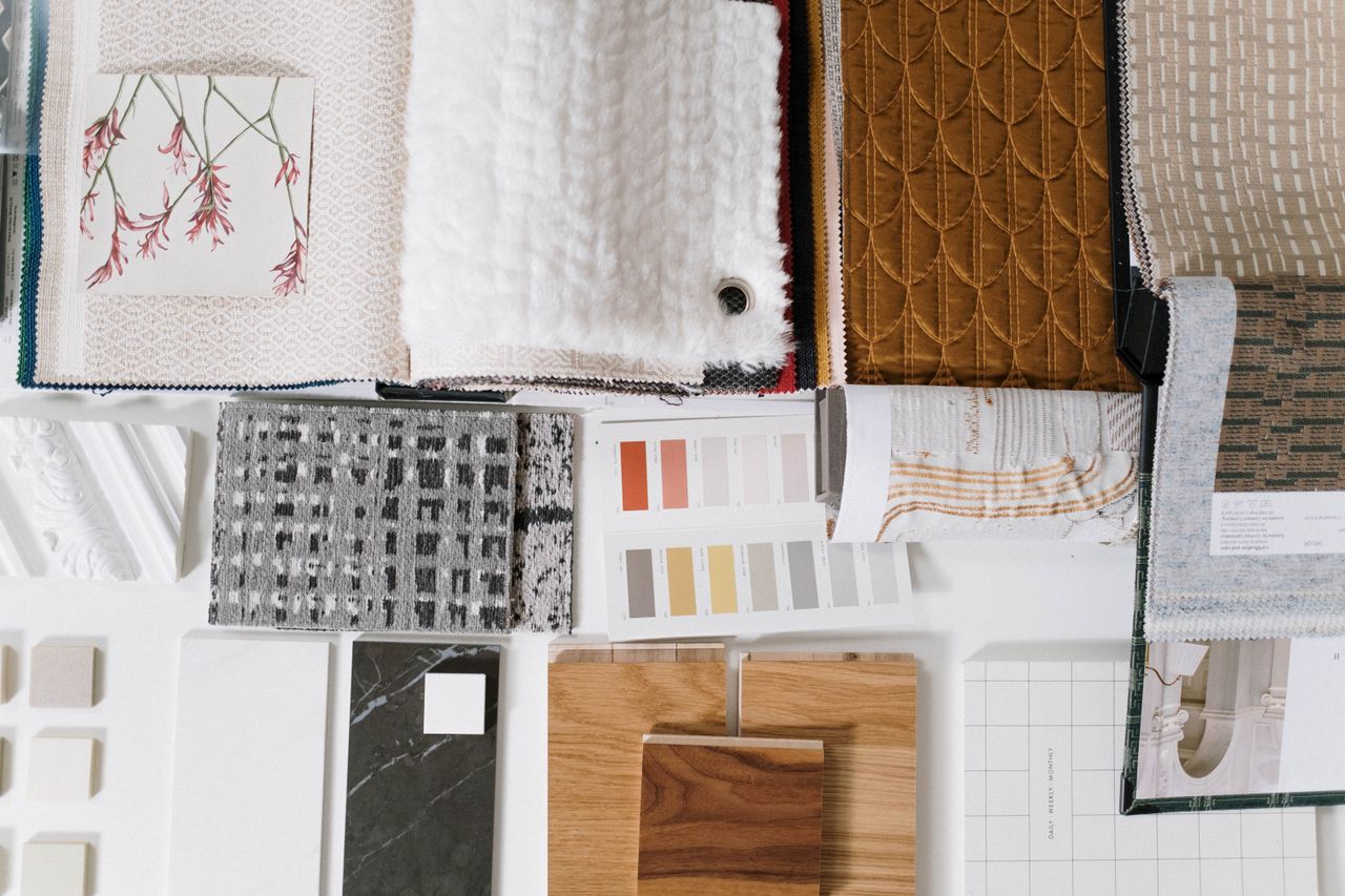 home-hero Assorted fabric and textile samples with color swatches for design inspiration.